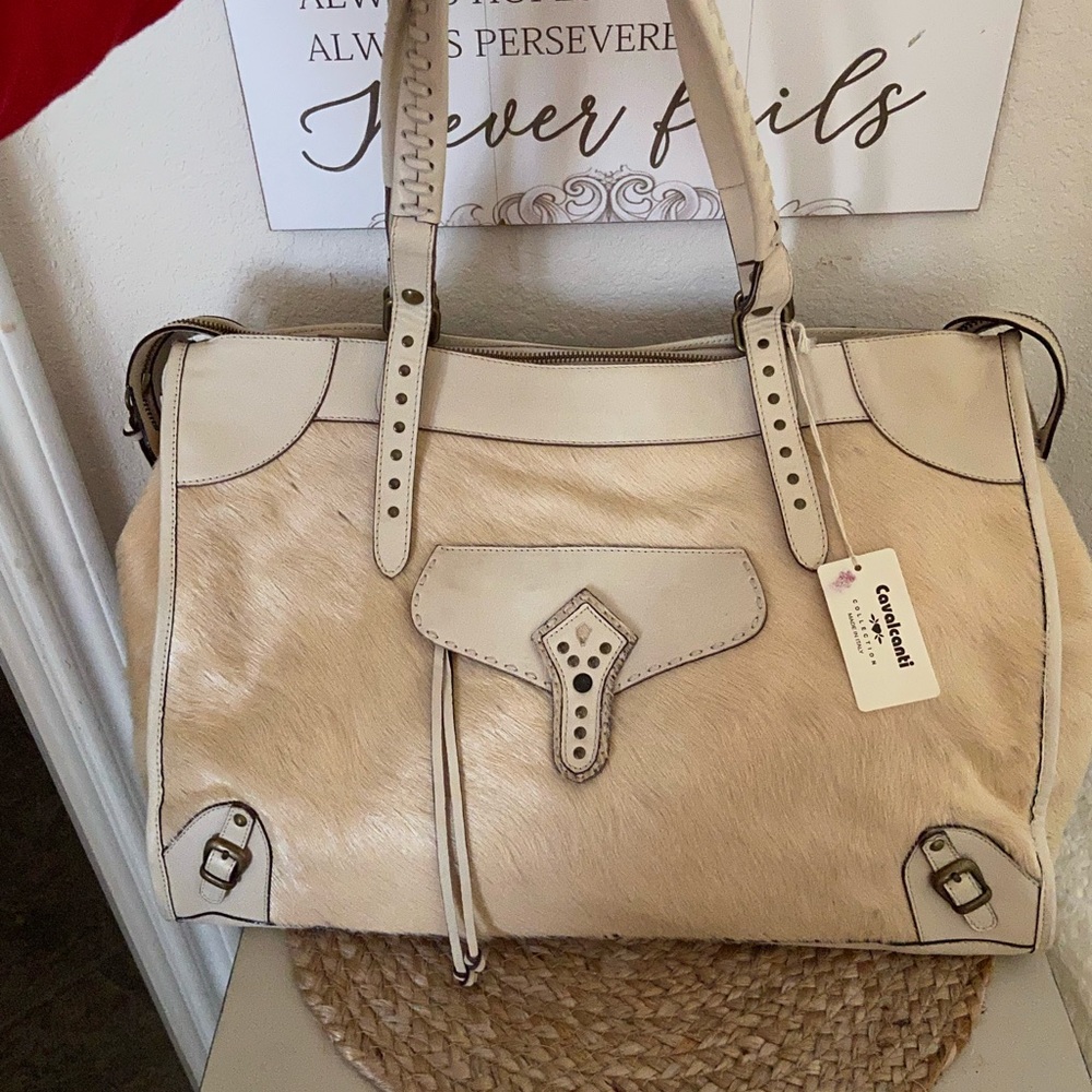 Cavalcanti Genuine Leather with calf hair. See photos for dimensions.